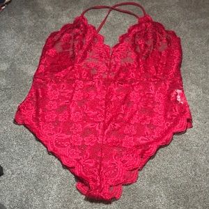 A red lacy lingerie bodysuit